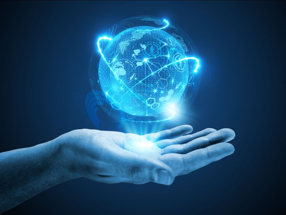 A hand holding a glowing digital globe with network connections, symbolizing global connectivity and data technology, set against a dark blue background.